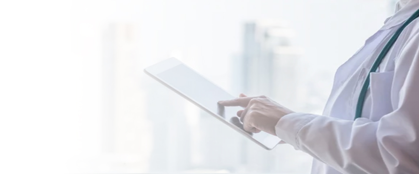 Doctor's hands holding a tablet